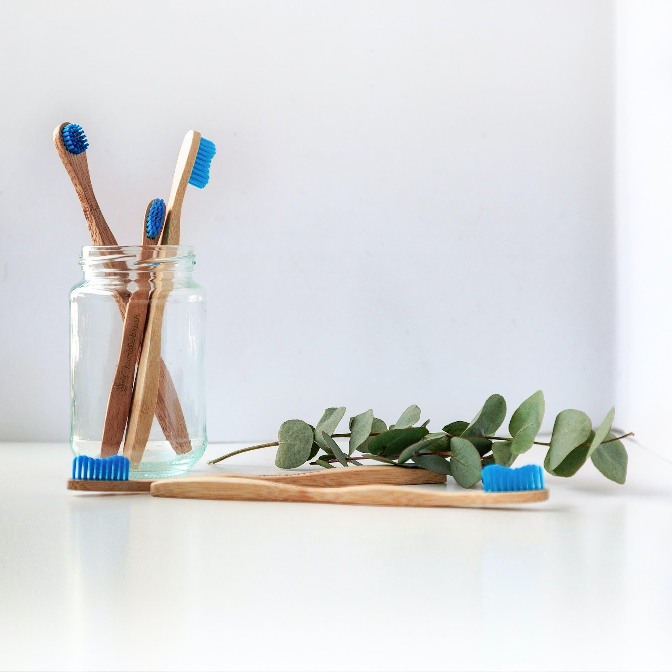 image of bamboo tooth brushes in a cup