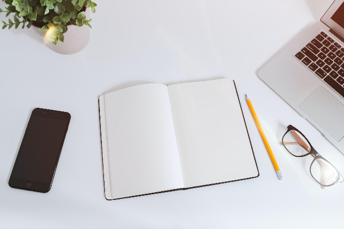 picture of desk with notebook